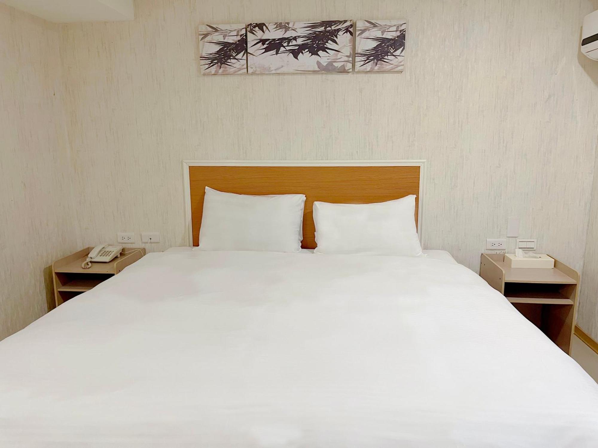 E Lim Hotel Zhongli Rum bild